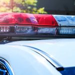 Police car roof with red and blue lights.