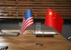 American and Chinese flags on a conference table.