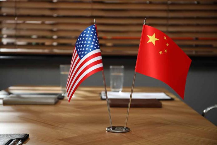 American and Chinese flags on a conference table.