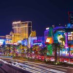 Las Vegas Strip at night with bright neon lights.