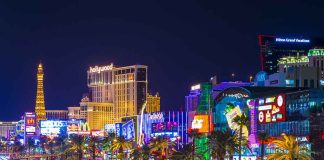 Las Vegas Strip at night with bright neon lights.