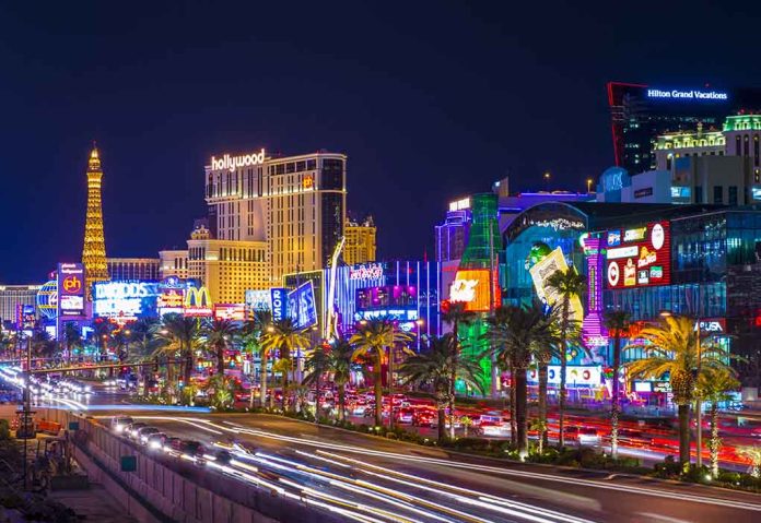 Las Vegas Strip at night with bright neon lights.