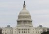 United States Capitol building under cloudy sky.