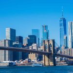 Brooklyn Bridge with Manhattan skyline in the background.