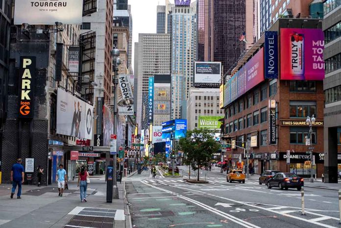 Times Square street scene with storefronts and advertisements.