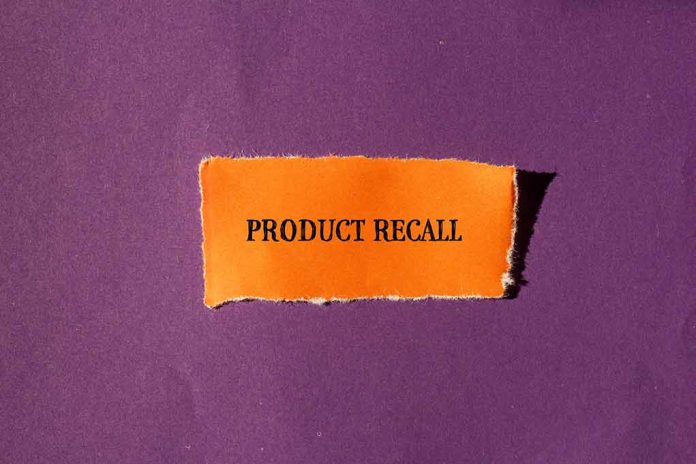 "Product Recall" text on orange paper, purple background.