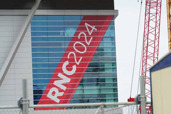 Building with "RNC 2024" sign, red construction cranes.