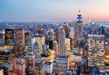 New York City skyline at dusk with skyscrapers.