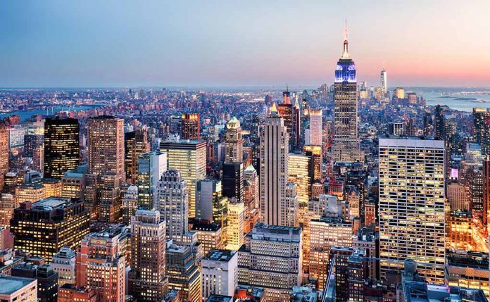 New York City skyline at dusk with skyscrapers.