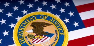 Department of Justice emblem on the American flag.