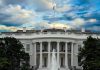 White House with a rainbow in the sky.