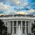 White House with a rainbow in the sky.