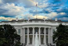 White House with a rainbow in the sky.