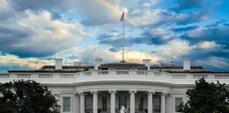 White House with a rainbow in the sky.