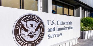 U.S. Citizenship and Immigration Services building sign.