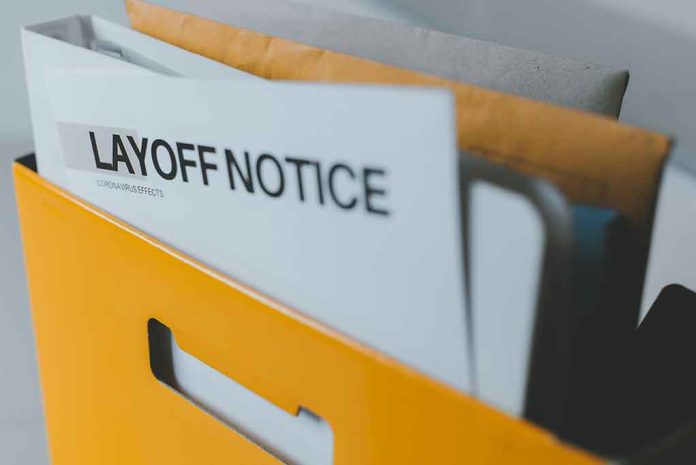 Layoff notice in a yellow box.