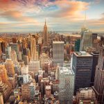 New York City skyline during colorful sunset.