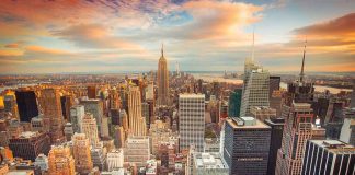 New York City skyline during colorful sunset.