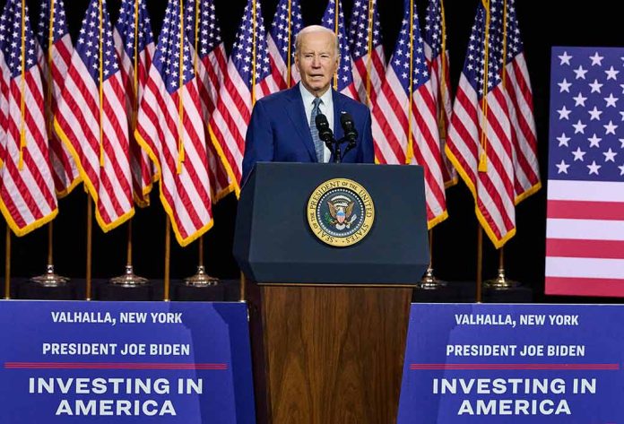 President speaks at podium with American flags behind.