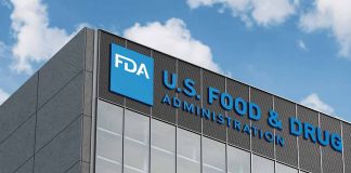 FDA building with blue logo and sky background.