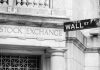 Stock Exchange building and Wall Street sign.