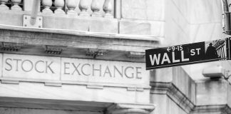 Stock Exchange building and Wall Street sign.