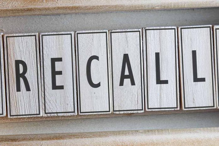 The word "RECALL" on wooden tiles.