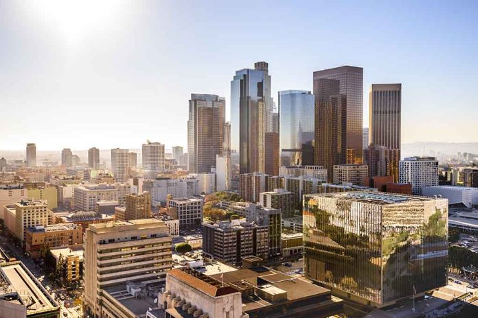 City skyline with tall buildings under a sunny sky.