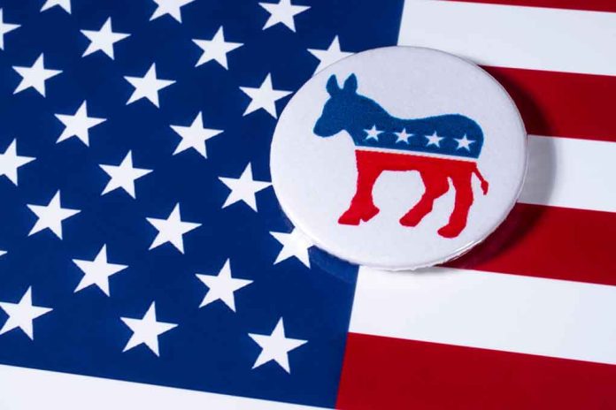 Democratic donkey button on American flag background.