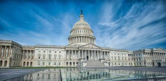 U.S. Capitol Building under a vibrant blue sky.