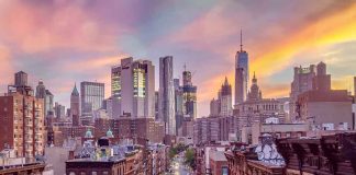 City skyline at sunset over busy urban street