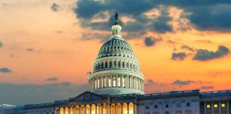 Capitol building at sunset with cloudy sky