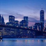 City skyline with bridge at twilight.