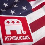 Red Republican elephant sign on U.S. flag.