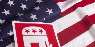 Red Republican elephant sign on U.S. flag.