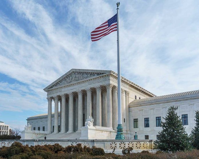 Supreme Court building with American flag flying.