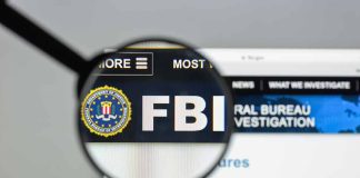 Magnifying glass over FBI logo on webpage