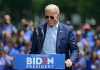 Man speaking at outdoor campaign event with sunglasses