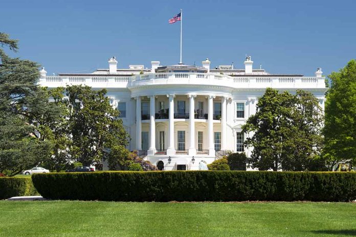 White House with American flag and green lawn