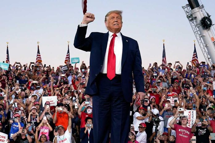 Person standing in front of cheering crowd.