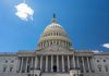 U.S. Capitol building against a clear blue sky.