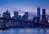 City skyline with bridge at twilight.