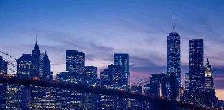 City skyline with bridge at twilight.