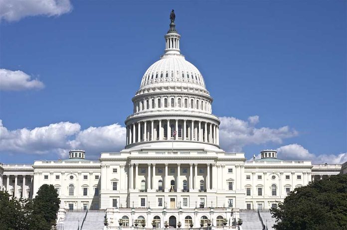 U.S. Capitol building against blue sky.