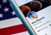 Phone displaying social media profile on American flag