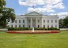 White House with fountain and American flag visible