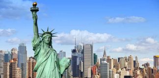 Statue of Liberty with New York City skyline.