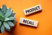 "Product recall" sign near succulent on orange background.