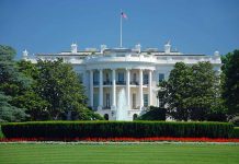 White House with American flag and fountain visible