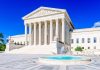 Supreme Court building with fountain under clear sky